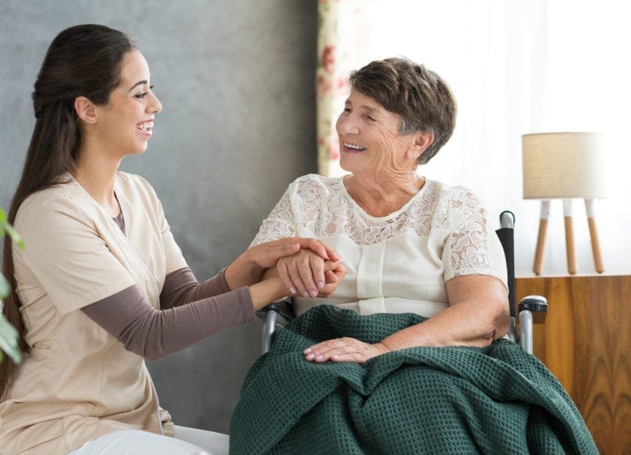 Senior sitting with caregiver to prepare for their time together